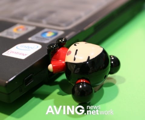 A 'PUCCA' figure USB memory used as a cell phone holder